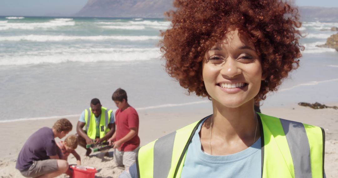 Happy Environmental Volunteer on Beach Conservation Project - Free Images, Stock Photos and Pictures on Pikwizard.com