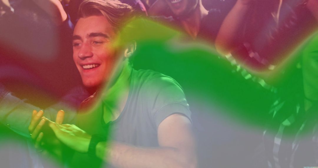 Smiling Man Enjoying Nightclub Atmosphere