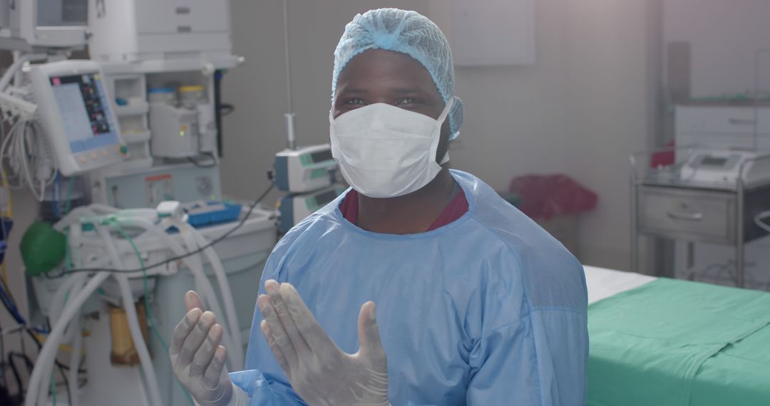 African American Surgeon Wearing Full Protective Gear Ready for Surgery - Free Images, Stock Photos and Pictures on Pikwizard.com