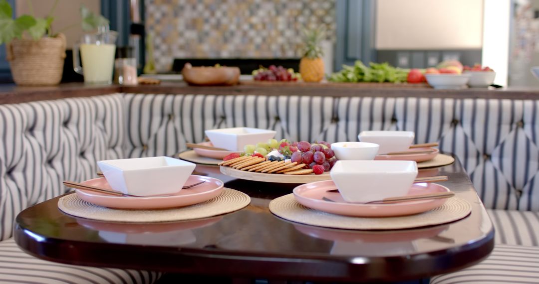 Elegant Dining Table Arrangement with Fruit and Cheese Platter