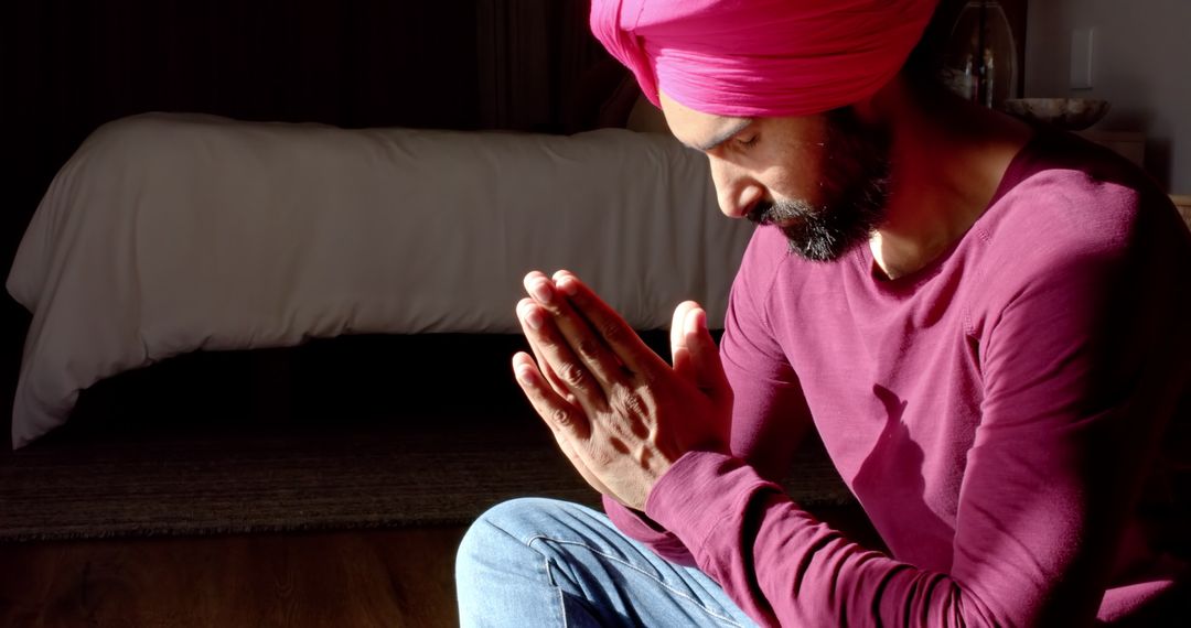 Man in Turban Meditating in Quiet Bedroom Setting