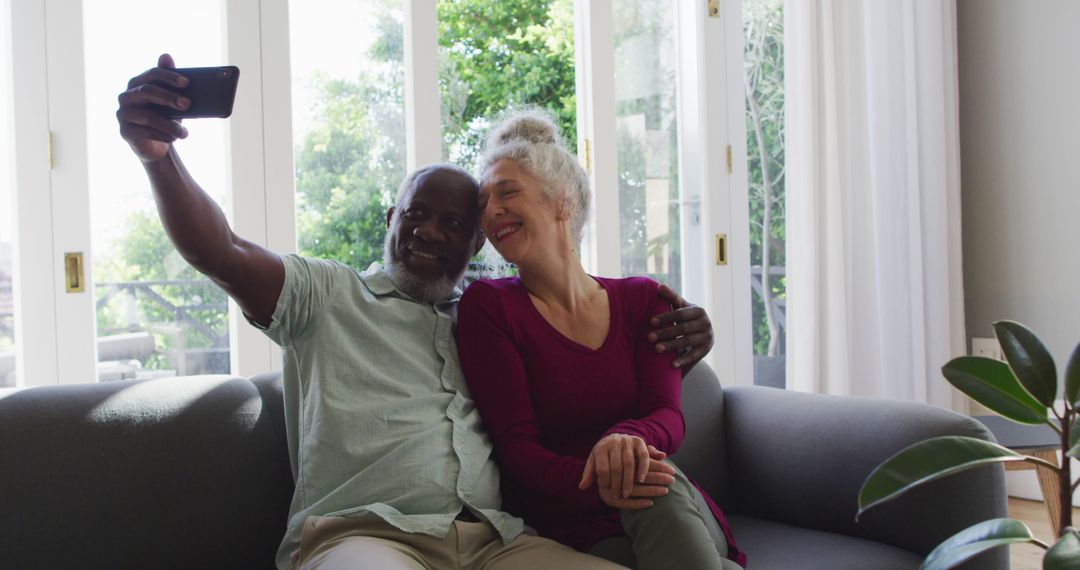 Senior Couple Taking Selfie Enjoying Quiet Time at Home