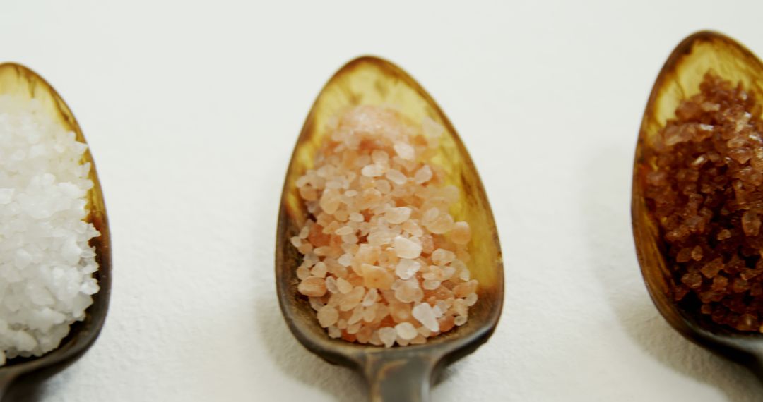 Variety of Sea Salts in Wooden Spoons - Free Images, Stock Photos and Pictures on Pikwizard.com