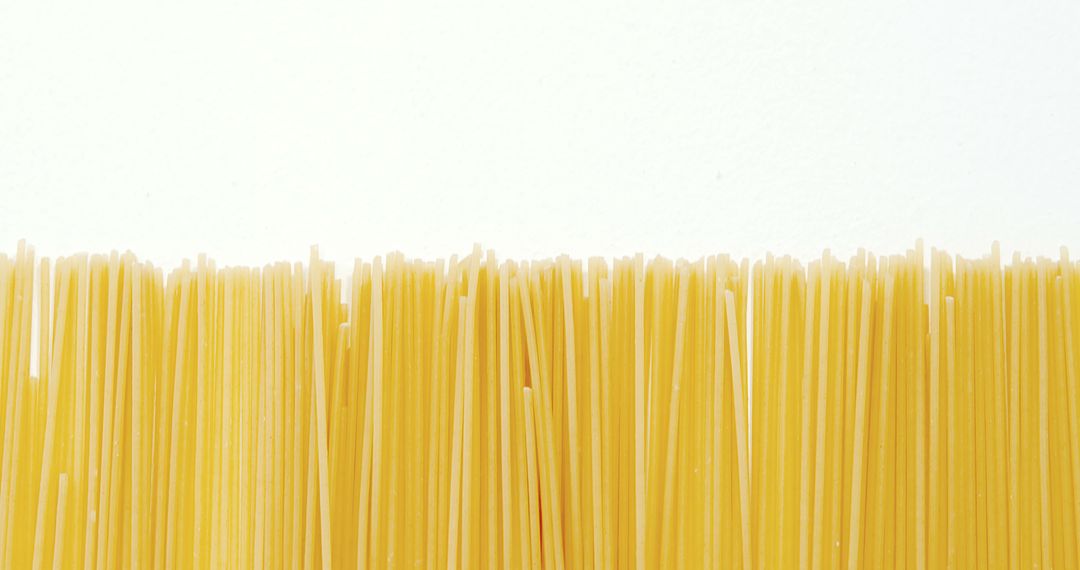 Uncooked Spaghetti on White Background - Free Images, Stock Photos and Pictures on Pikwizard.com