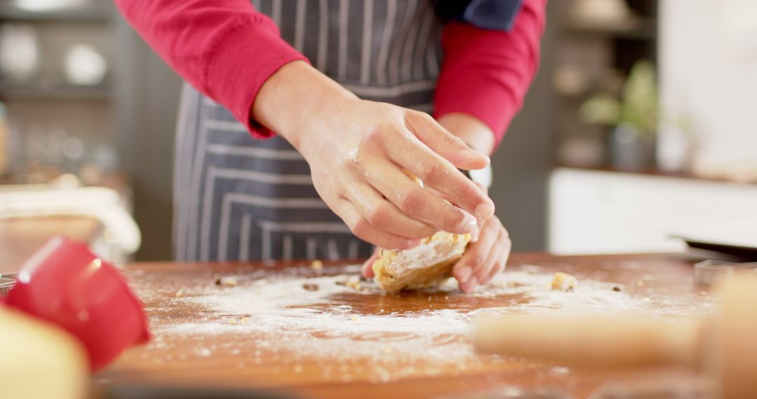 Person baking with dough on wooden surface - Free Images, Stock Photos and Pictures on Pikwizard.com