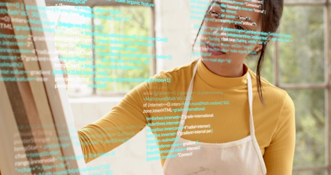 Creative artist-coder tracing virtual code overlay on sunlit studio glass with easel