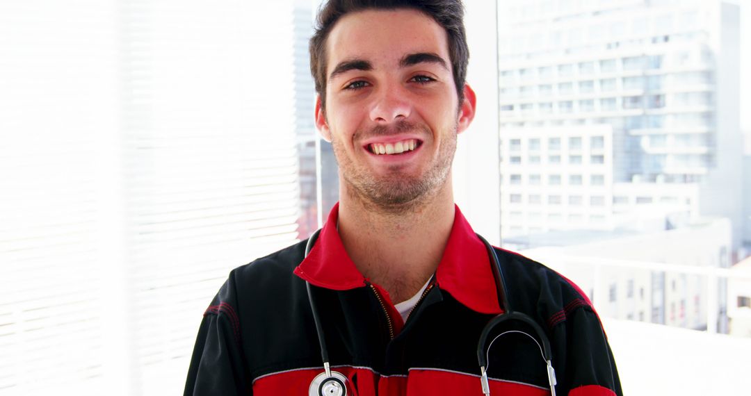 Smiling Male Paramedic with Stethoscope in Urban Setting - Free Images, Stock Photos and Pictures on Pikwizard.com