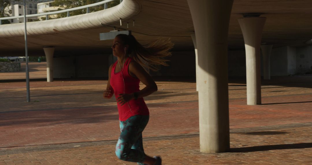 Woman Running Under Urban Overpass During Sunset - Free Images, Stock Photos and Pictures on Pikwizard.com