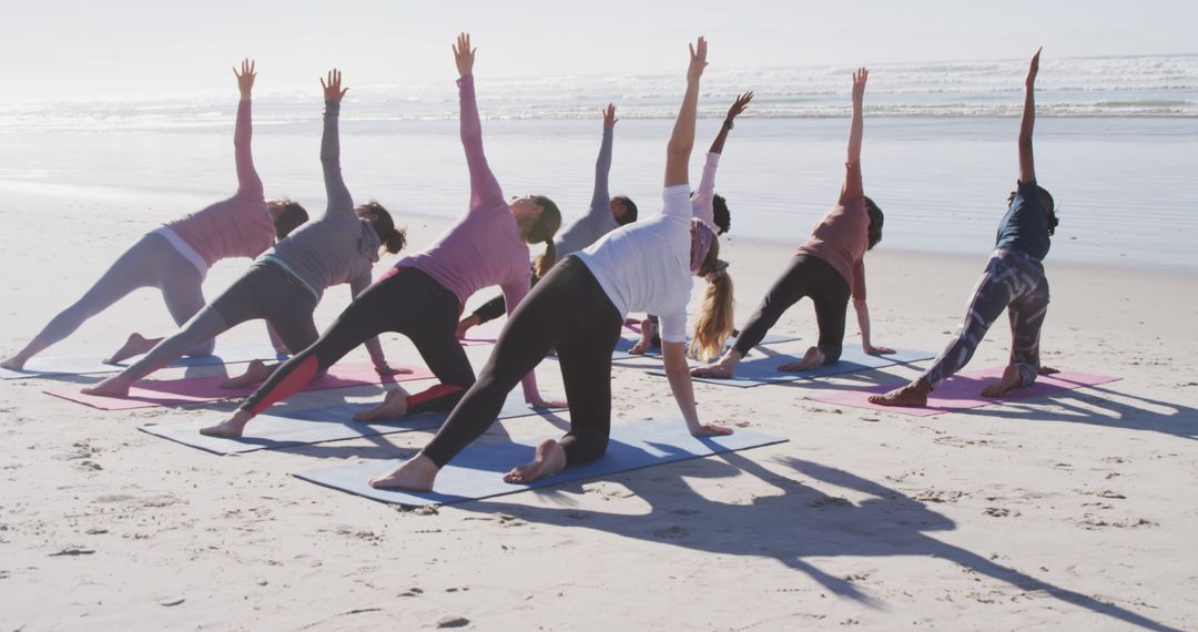 Group of Women Doing Yoga on Beach - Free Images, Stock Photos and Pictures on Pikwizard.com