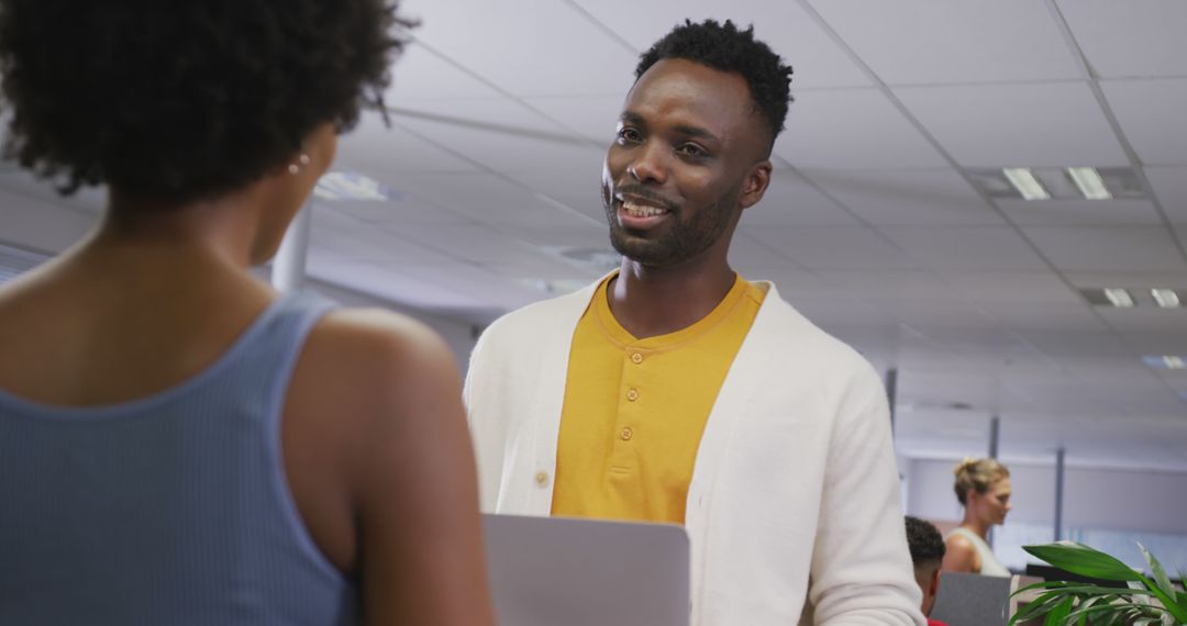 Coworkers Engaging in Productive Office Discussion