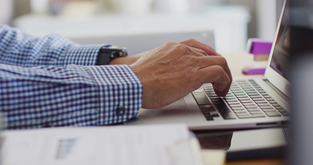 Businessperson Typing on Laptop Keyboard in Office - Free Images, Stock Photos and Pictures on Pikwizard.com