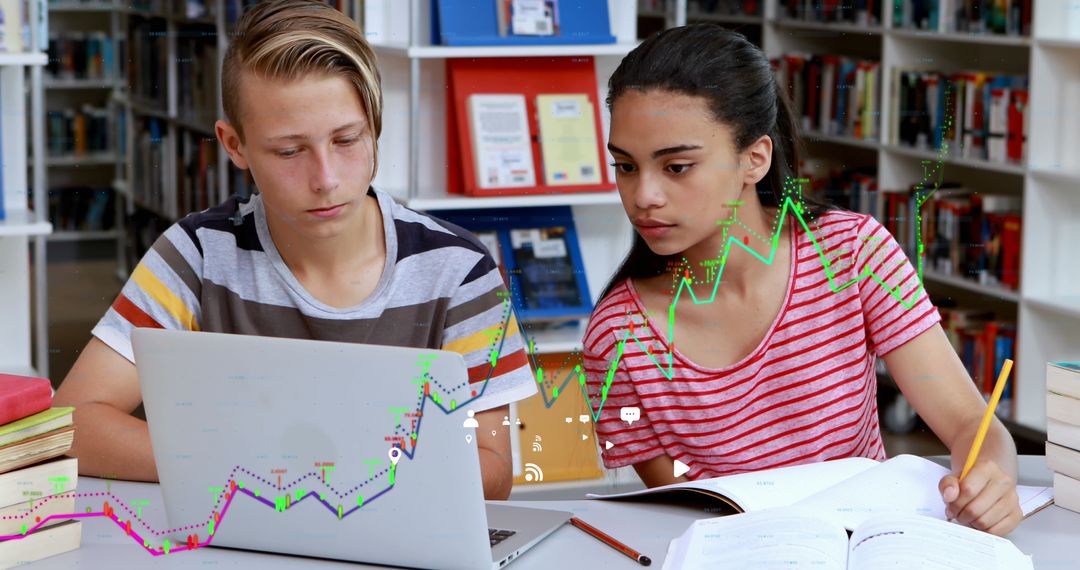 School Students Analyzing Data with Laptop in Library
