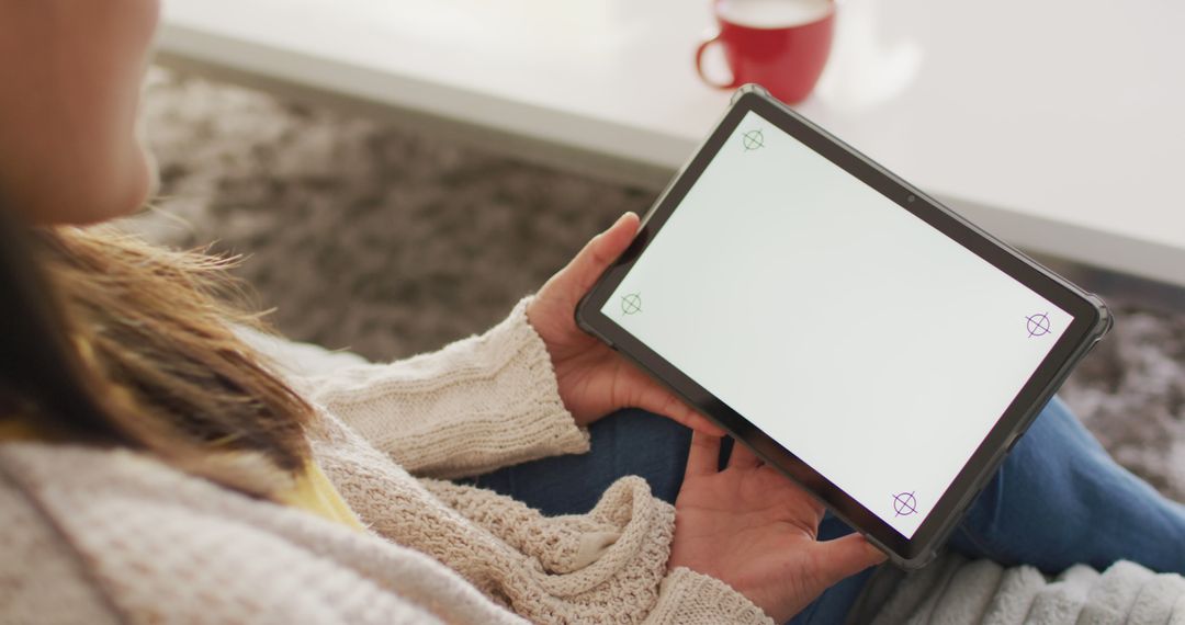 Woman Relaxing at Home Using Digital Tablet - Free Images, Stock Photos and Pictures on Pikwizard.com