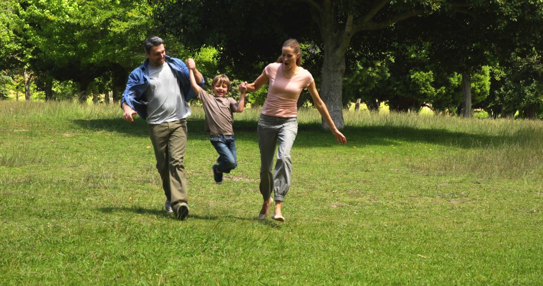 Happy Family Playing in Park - Free Images, Stock Photos and Pictures on Pikwizard.com