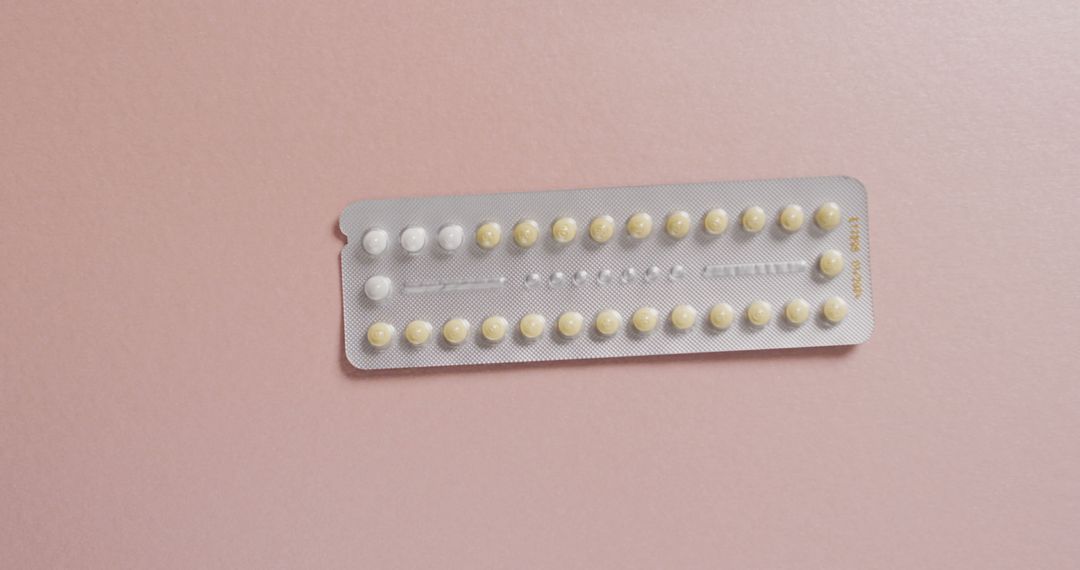 Image of close up of yellow tablets on pink background - Free Images, Stock Photos and Pictures on Pikwizard.com