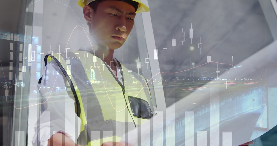 Asian Architect Analyzing Building Schematics With Financial Data Integration