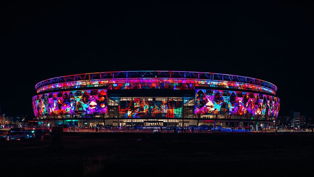Colourful Projection Mapping on Modern Stadium Exterior at Night