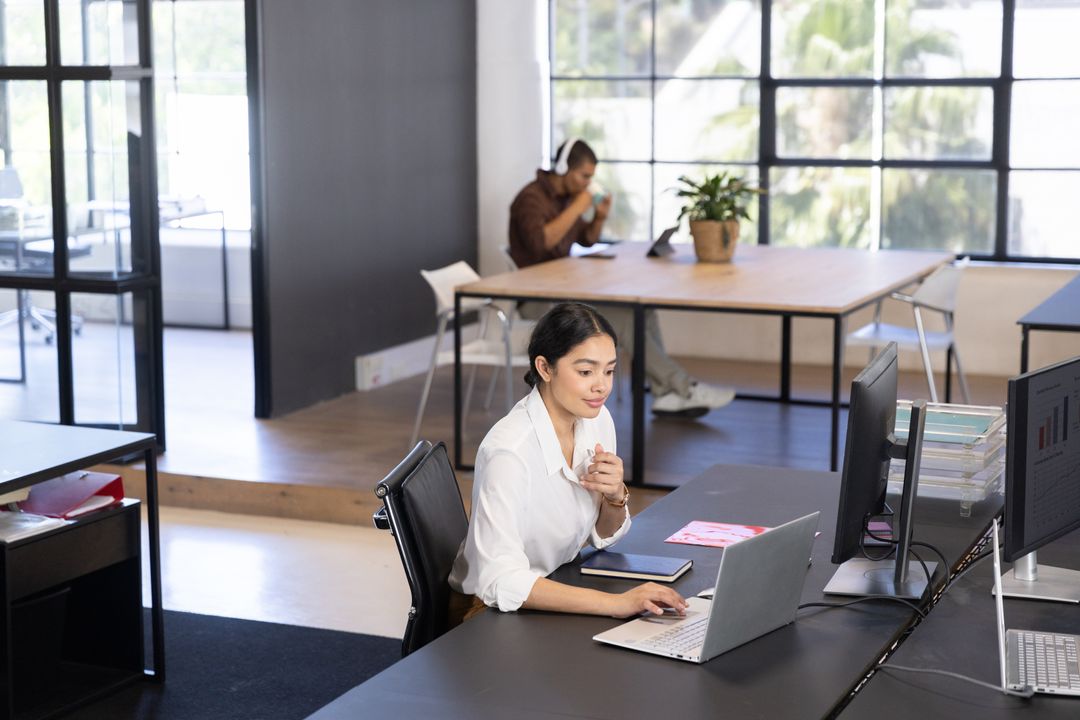 Modern Open Office with Focused Professionals Working