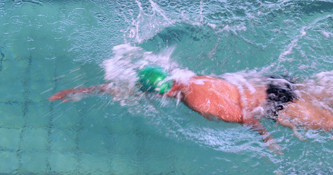 Man Swimming Freestyle in Clear Blue Water Pool - Free Images, Stock Photos and Pictures on Pikwizard.com