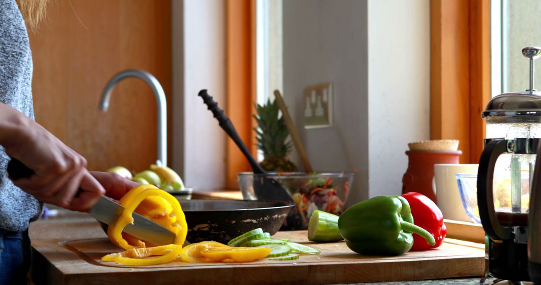 Slicing Bell Peppers in Cozy Kitchen - Free Images, Stock Photos and Pictures on Pikwizard.com