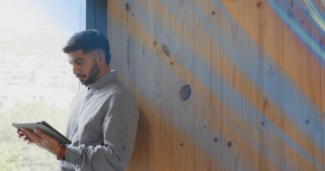 Business Professional Engaging with Tablet in Modern Office Setting