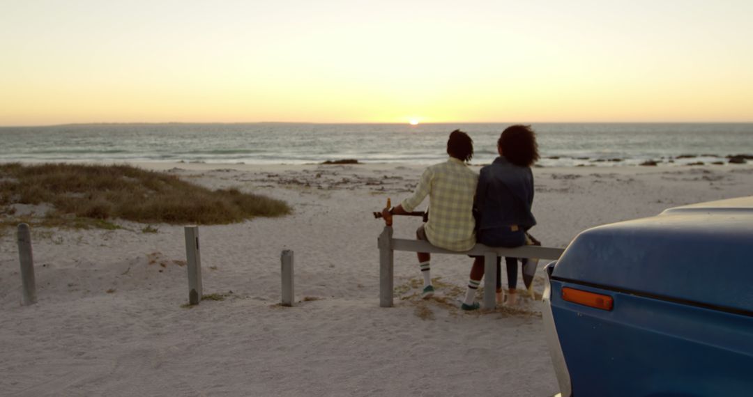 Couple Watching Sunset on Bench by Beach, Relaxing Outdoors - Free Images, Stock Photos and Pictures on Pikwizard.com