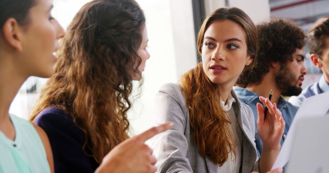 Group of Young Professionals Having a Brainstorming Session in Office - Free Images, Stock Photos and Pictures on Pikwizard.com