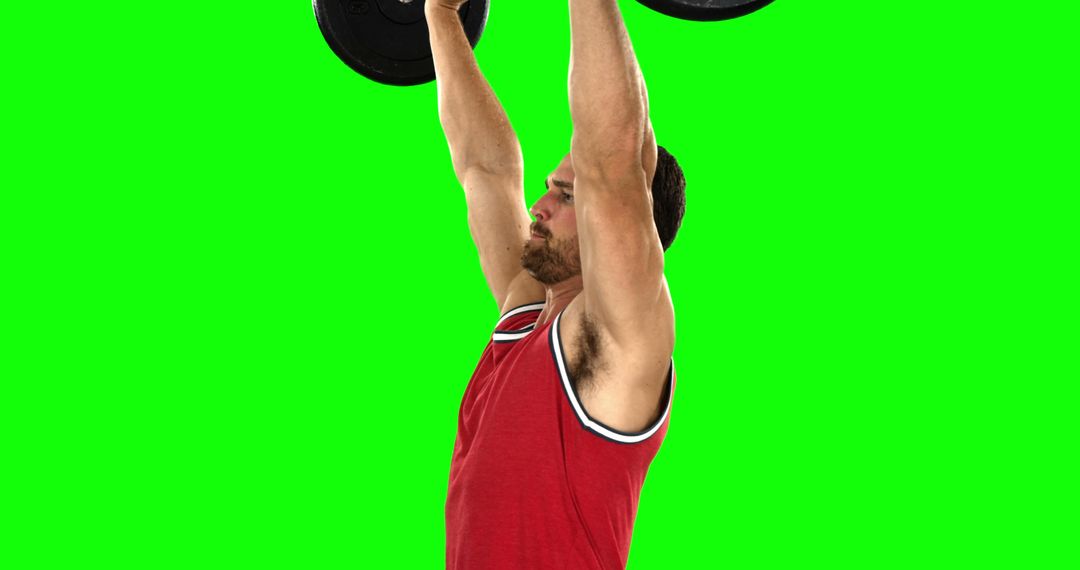 Fit Man Lifting Weights Against Green Background - Free Images, Stock Photos and Pictures on Pikwizard.com