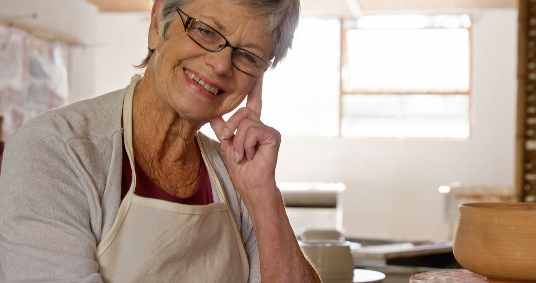 Senior Woman Pottery Artist in Studio Smiling - Free Images, Stock Photos and Pictures on Pikwizard.com