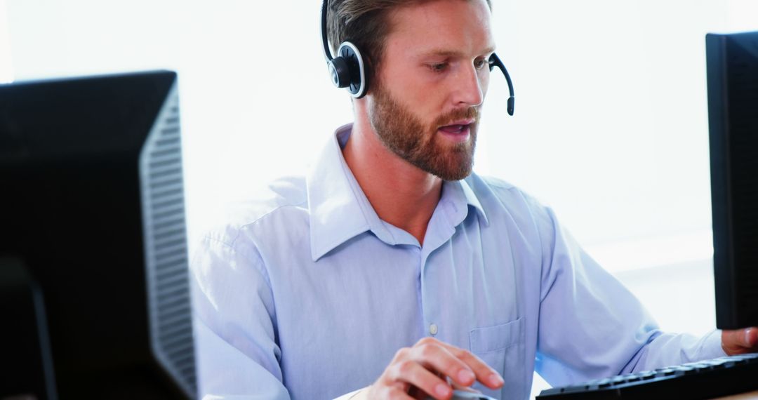 Male Customer Service Representative Working with Headset - Free Images, Stock Photos and Pictures on Pikwizard.com