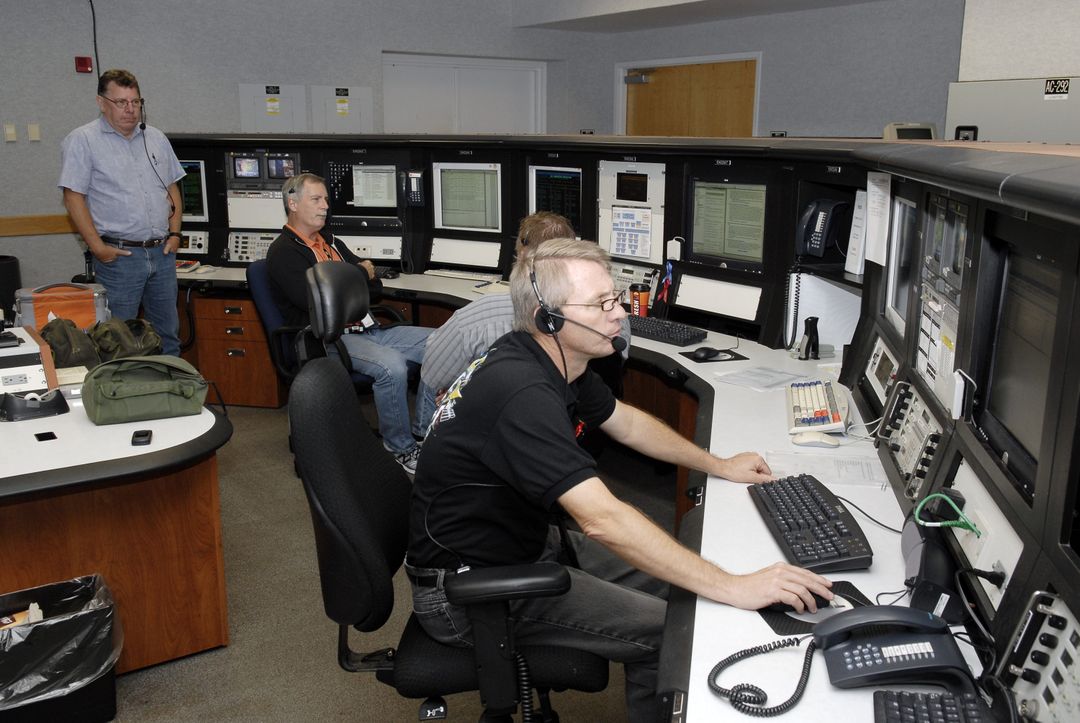 Technicians Monitoring Firing Room 4 Console at NASA’s Launch Control Center - Free Images, Stock Photos and Pictures on Pikwizard.com