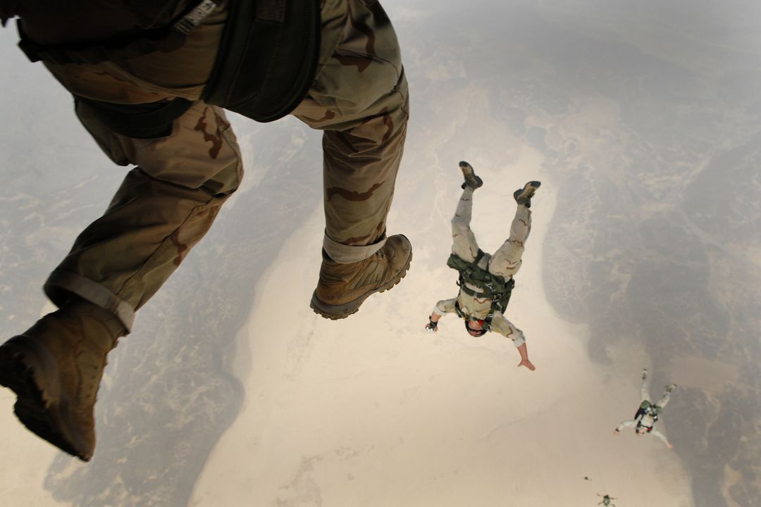 Paratroopers Freefalling Above Desert Landscape - Free Images, Stock Photos and Pictures on Pikwizard.com