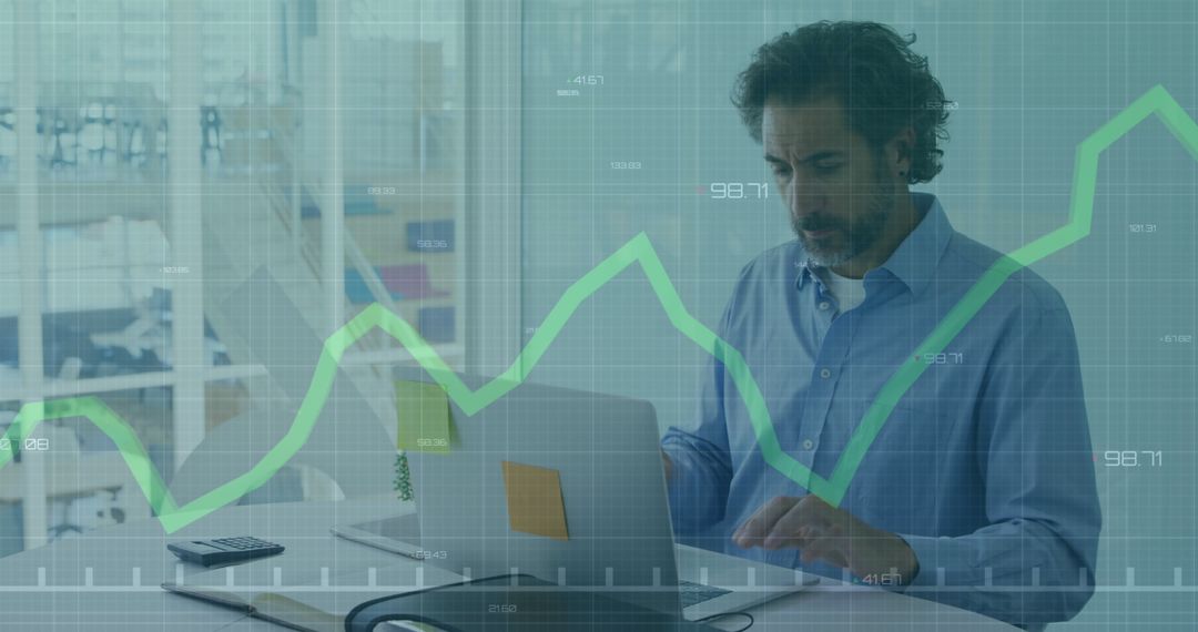 Businessman Analyzing Data with Stock Market Graph Projection - Free Images, Stock Photos and Pictures on Pikwizard.com