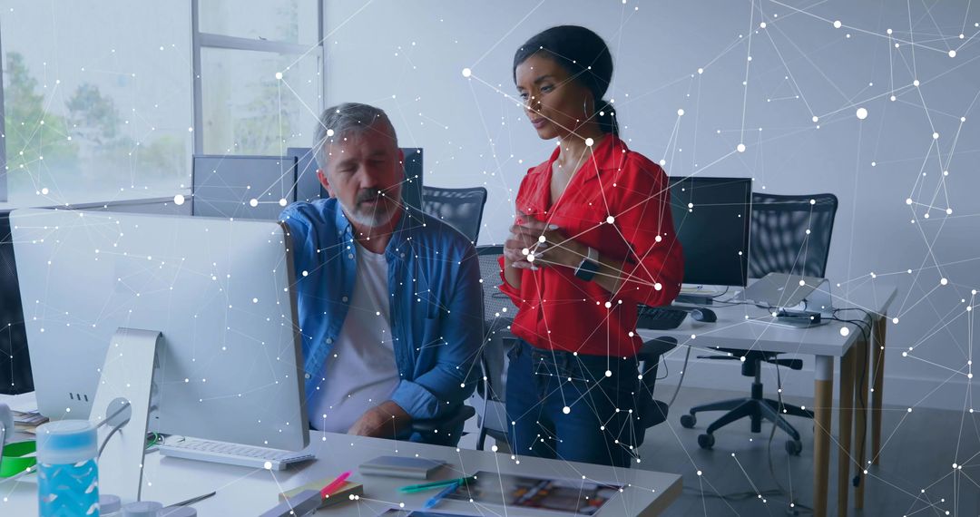 Colleagues Collaborating with Digital Network Diagram in Modern Office
