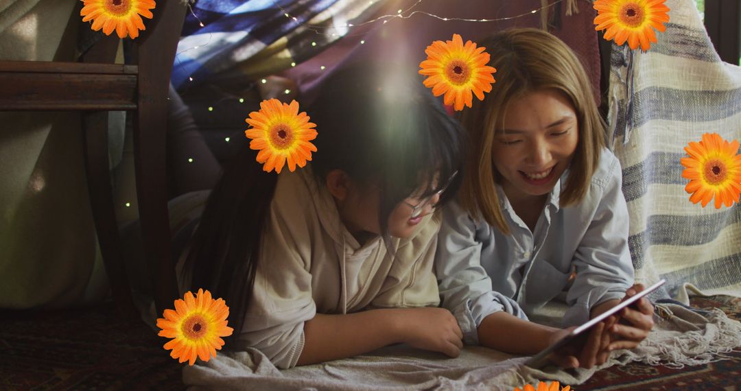 Happy Mother and Daughter Sharing Tablet Joy at Home