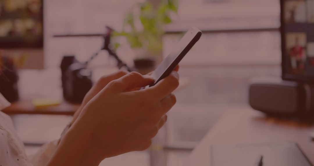 Woman Using Smartphone While Analyzing Data on Screen
