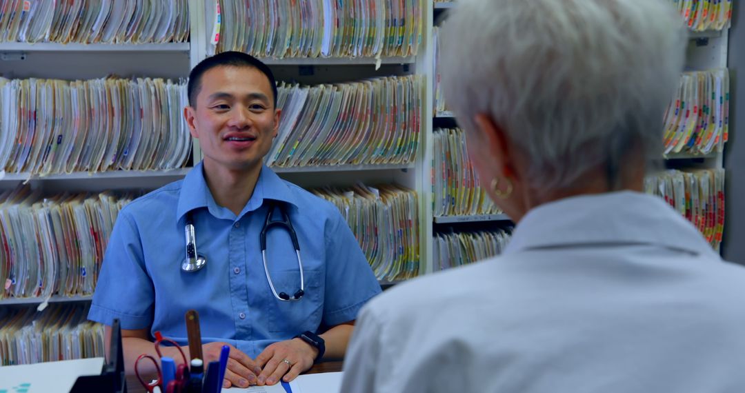 Doctor Consults Elderly Patient in Medical Office - Free Images, Stock Photos and Pictures on Pikwizard.com