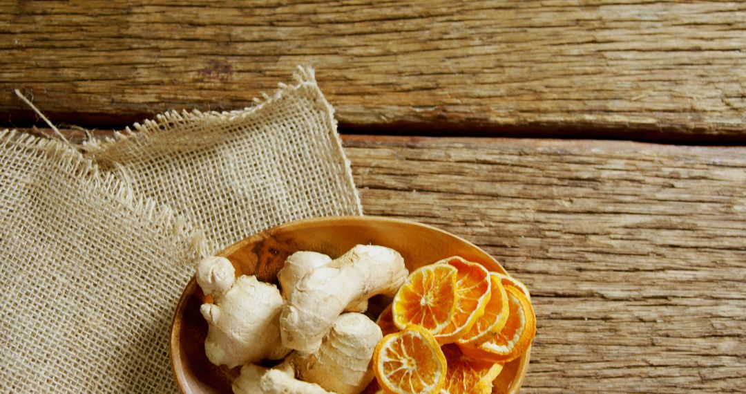 Ginger Root and Dried Orange Slices on Rustic Wooden Table - Free Images, Stock Photos and Pictures on Pikwizard.com