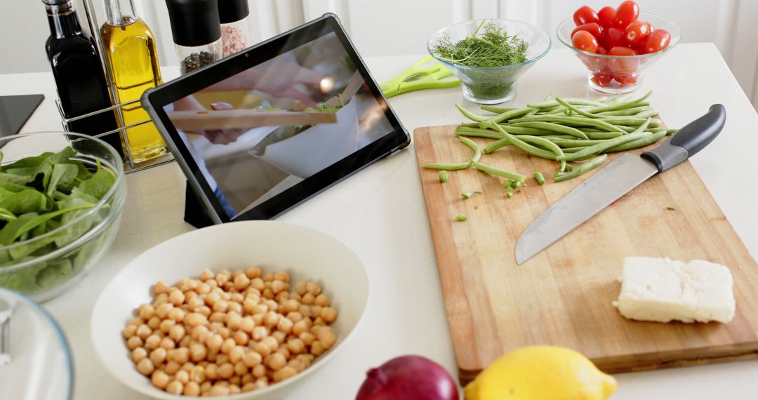 Tablet with Cooking Video in Modern Kitchen Setup - Free Images, Stock Photos and Pictures on Pikwizard.com