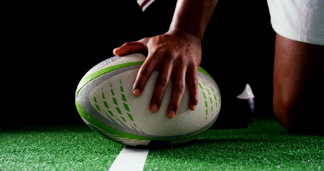 Close-Up of Rugby Player Placing Ball on Field - Free Images, Stock Photos and Pictures on Pikwizard.com