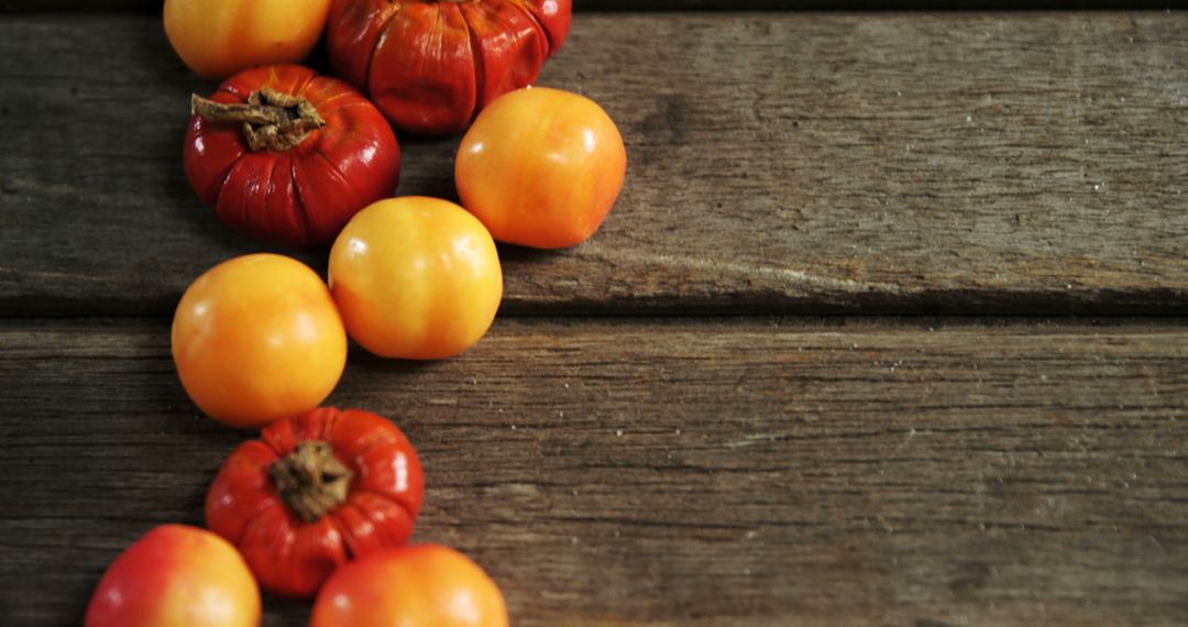 Colorful Autumn Persimmons on Rustic Wood Table - Free Images, Stock Photos and Pictures on Pikwizard.com