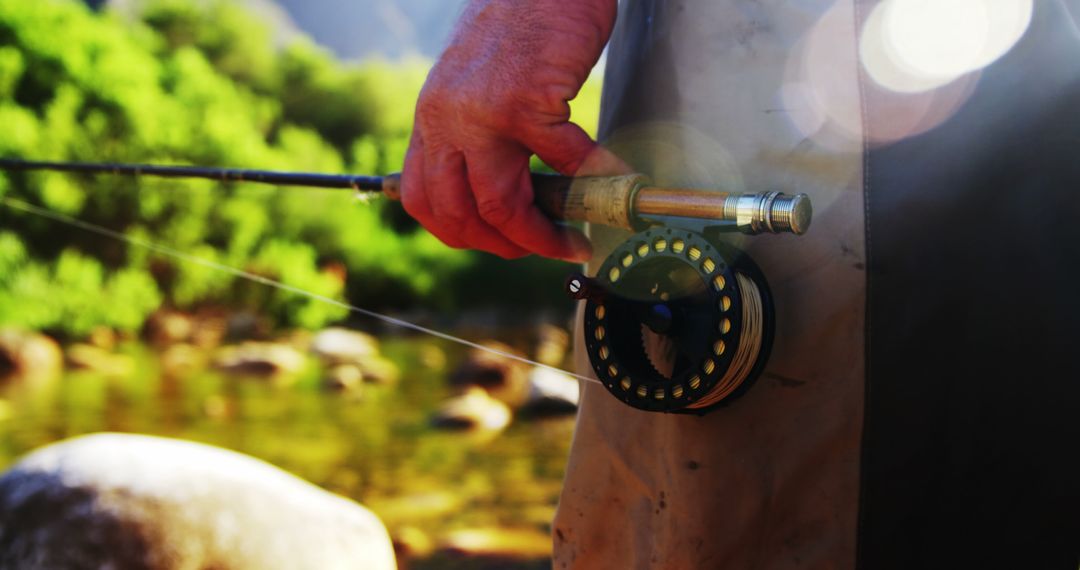 Close Up of Person Holding Fishing Rod Outdoors During Daytime - Free Images, Stock Photos and Pictures on Pikwizard.com