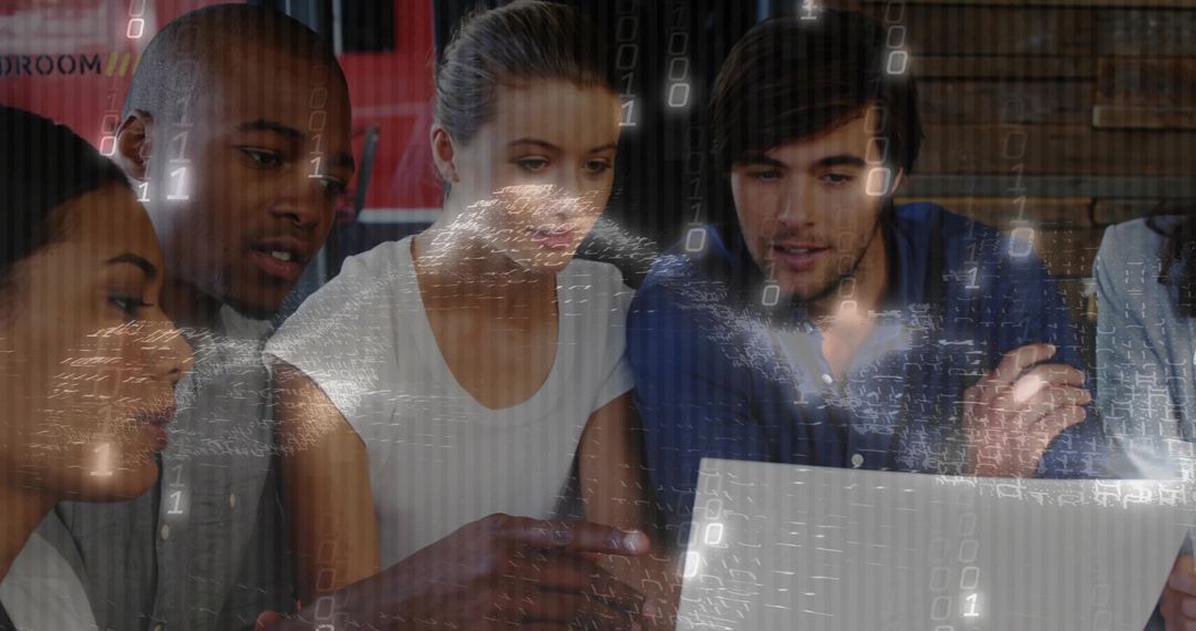 Team collaborating around laptop with digital binary overlay and data visualization