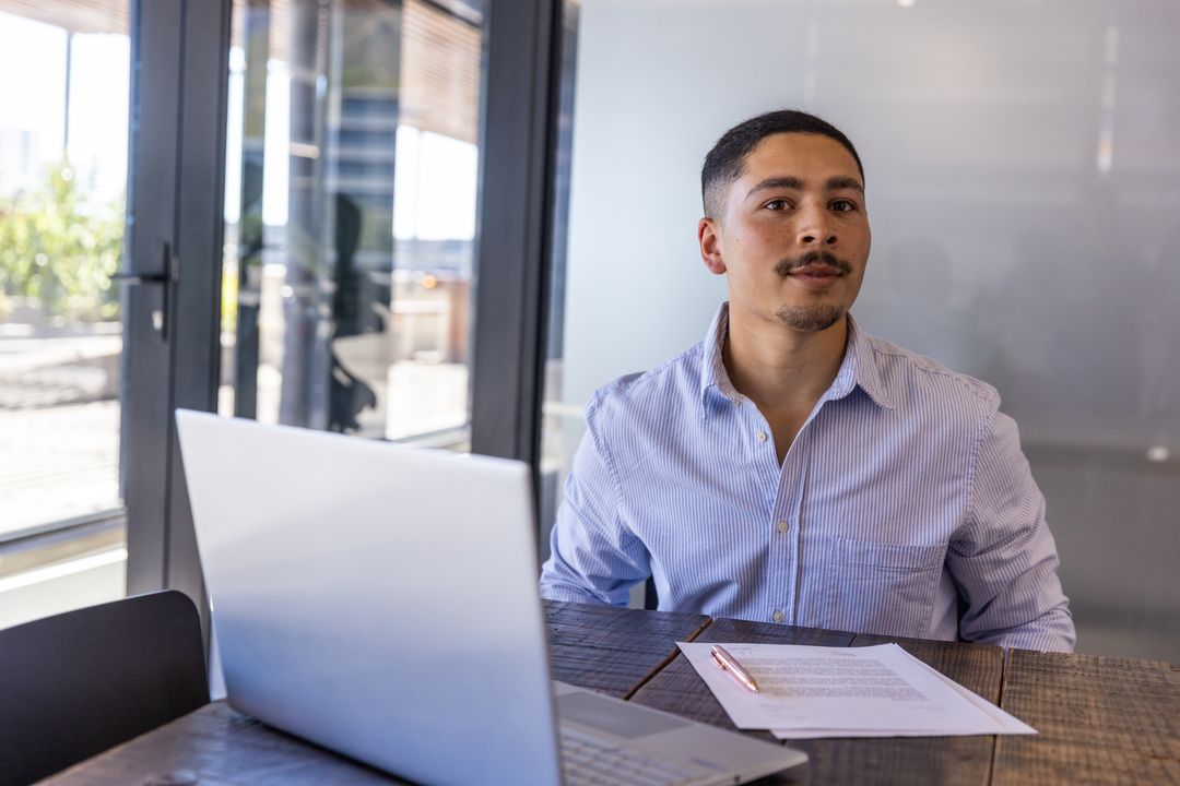 Professional Reviewing Document in Modern Office Environment