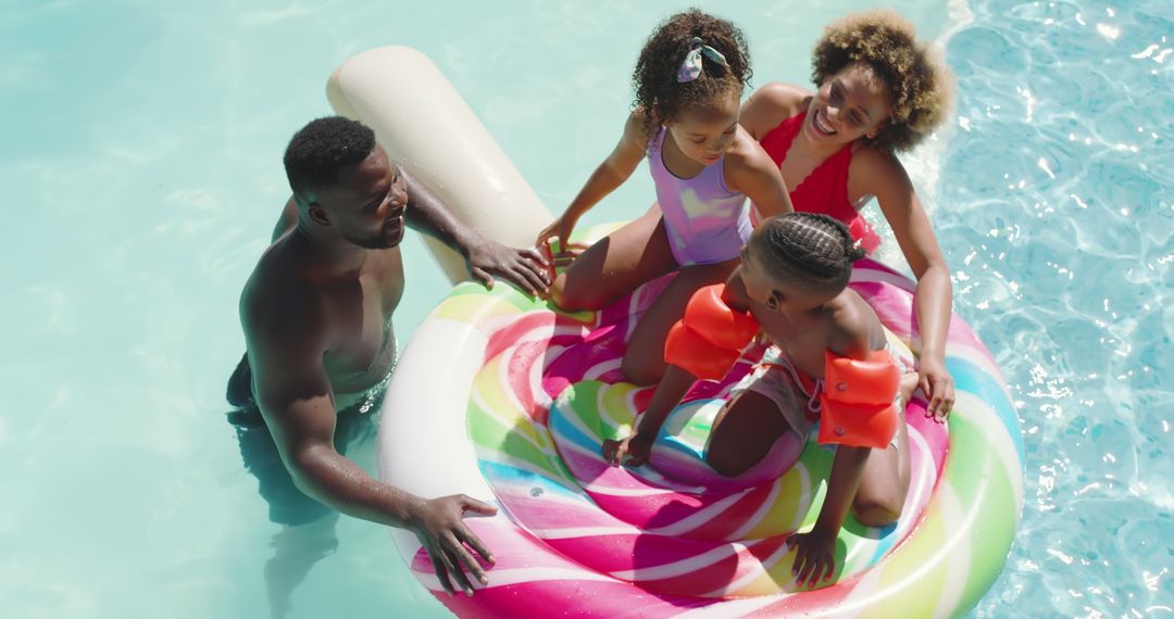 Happy African American Family Enjoying Pool Time Fun Together