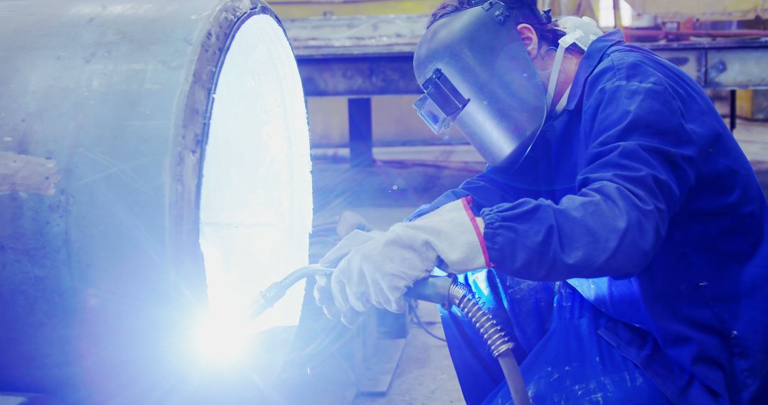 Welding Worker Wearing Protective Mask and Gloves - Free Images, Stock Photos and Pictures on Pikwizard.com