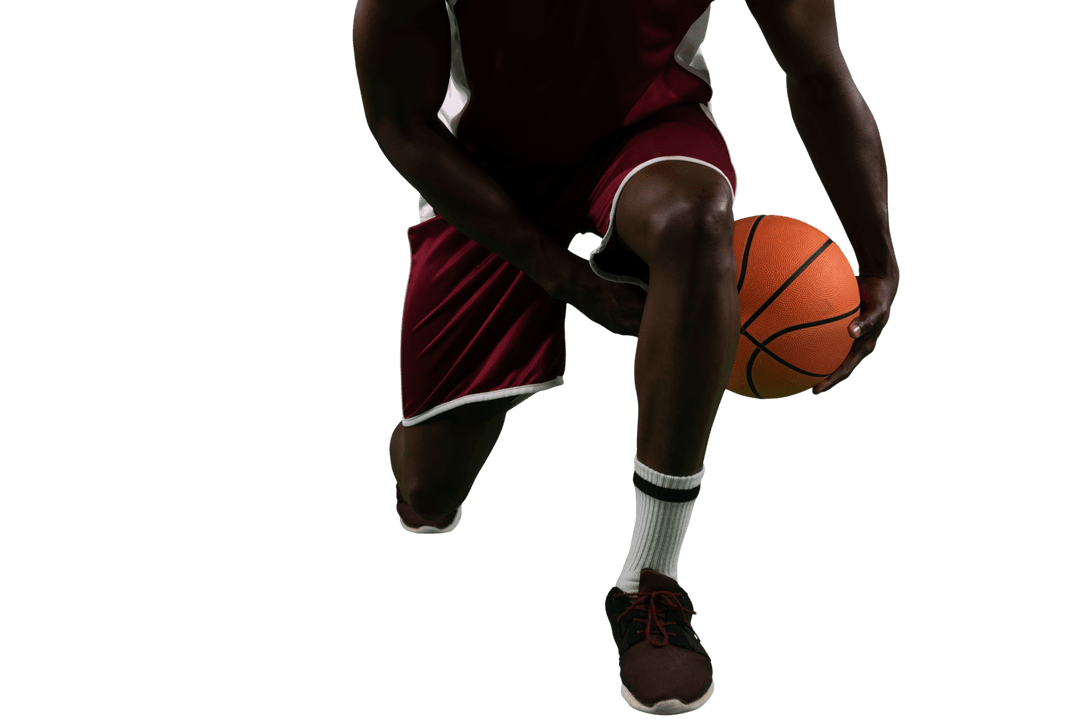 Low Angle of Basketball Player Dribbling Ball on Transparent Background