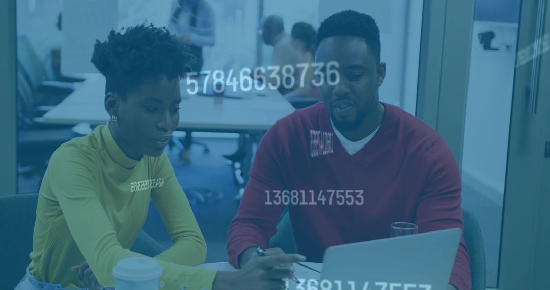 Professionals Collaborating on Data Analytics in Modern Office