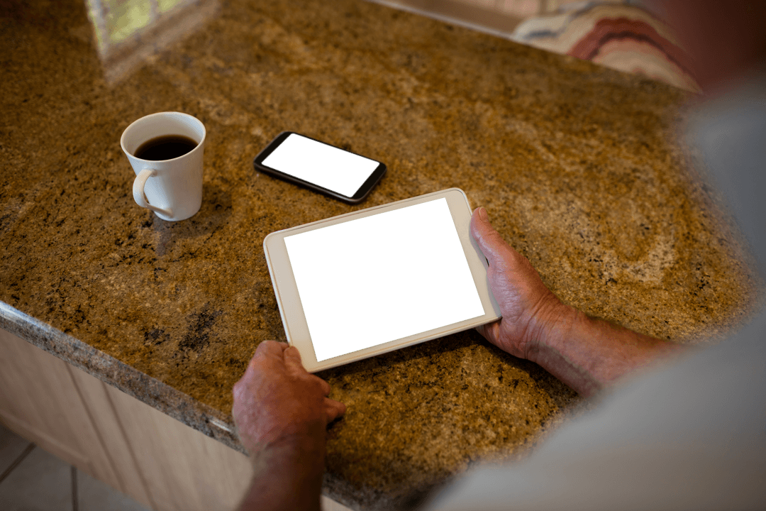 Senior Holding Transparent Tablet Digital Age at Home