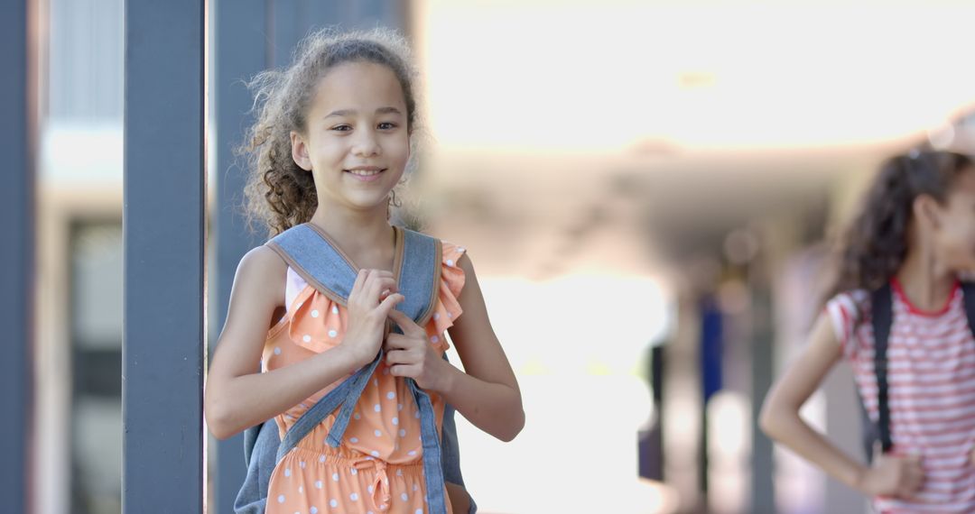 Smiling Girl with Backpack Embracing School Life